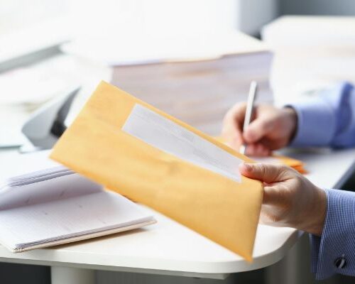 Mailroom Software Courier man delivering corporate documents to a law firm.